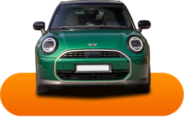 Front view of a sleek green car with round headlights, sitting on an orange platform, set against a black background, conveying a modern and stylish look.