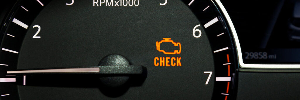 Check Engine light on in Rockville, MD with MB Automotive Services. Image of check engine light on car dash.