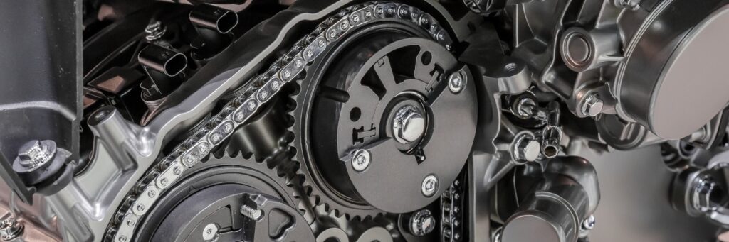 Vehicle maintenance in Rockville, MD at MB Automotive Services. Close-up image of a timing chain in a cutaway engine, highlighting potential issues with timing chain.