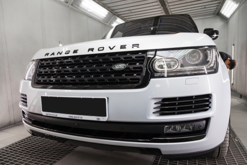 Range Rover Repair and Maintenance in Rockville, MD at MB Automotive Services. Image of a white and black Land Rover Range Rover Autobiography parked in the auto service waiting area, undergoing preventative maintenance.