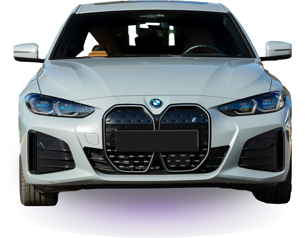 Front view of a sleek white BMW car with a distinctive kidney grille and blue-tinted headlights against a black background, exuding modern elegance.