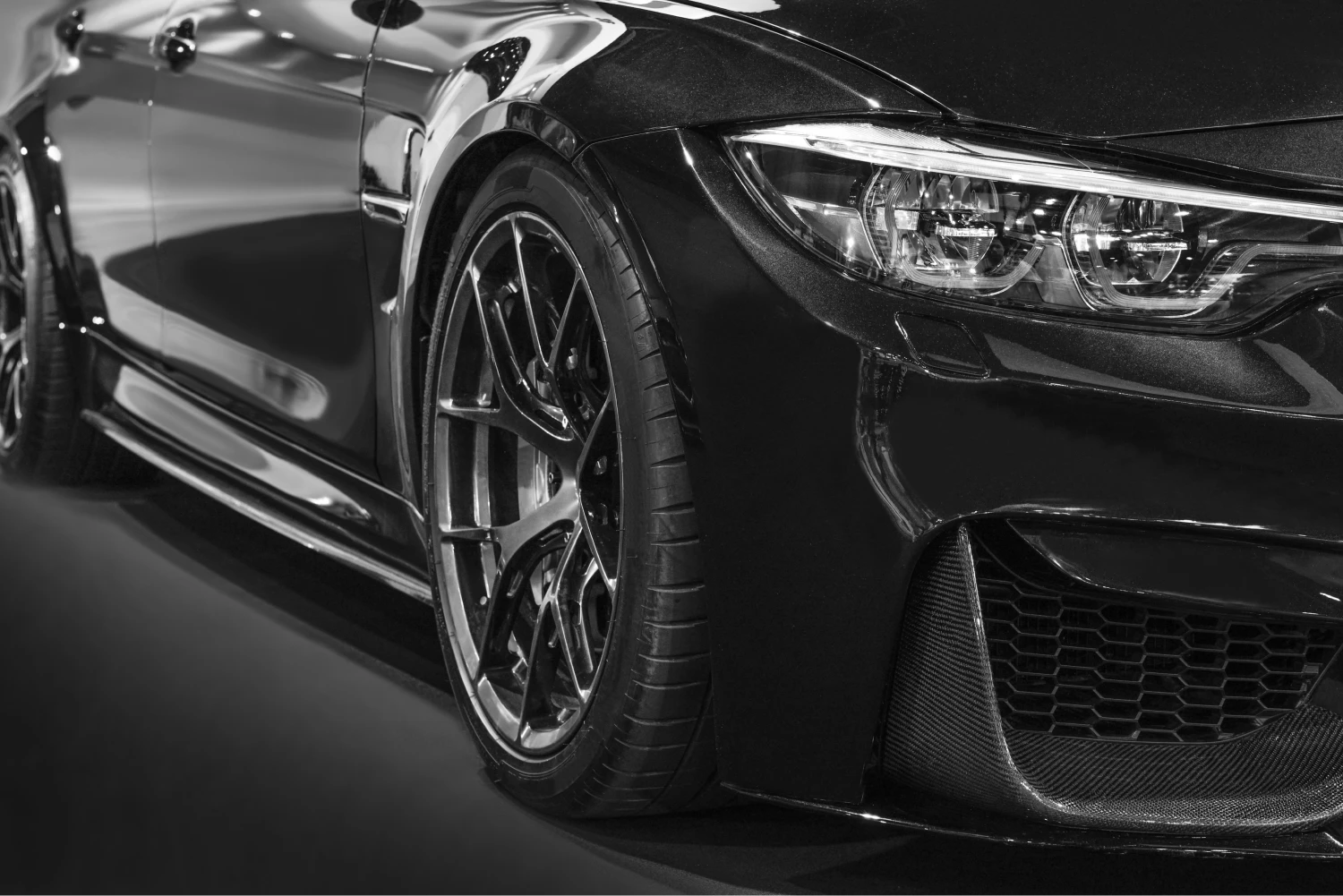 A silver SUV is parked on a foggy, urban street lined with cars and buildings. The image has a moody, atmospheric tone, accentuated by warm overlay shades.